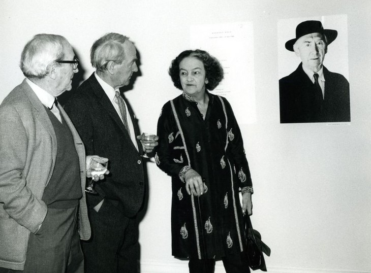 Naum Gabo, Henry Moore and Barbara Hepworth next to a portrait of Herbert Read at the Herbert Read Memorial exhibition at the Tate Gallery 1968