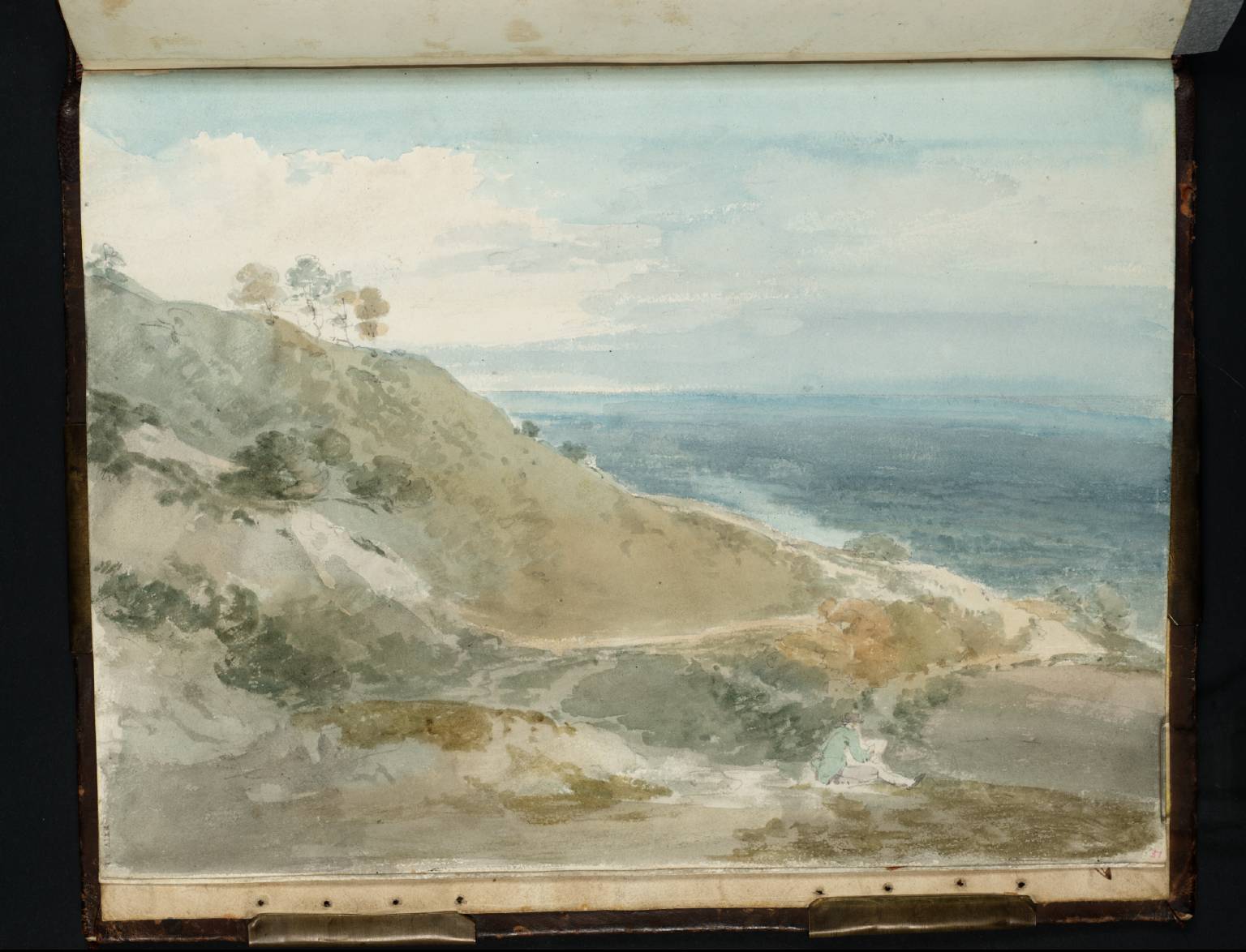 A Man Seated on a Hillside, Sketching; a Broad Plain Beyond