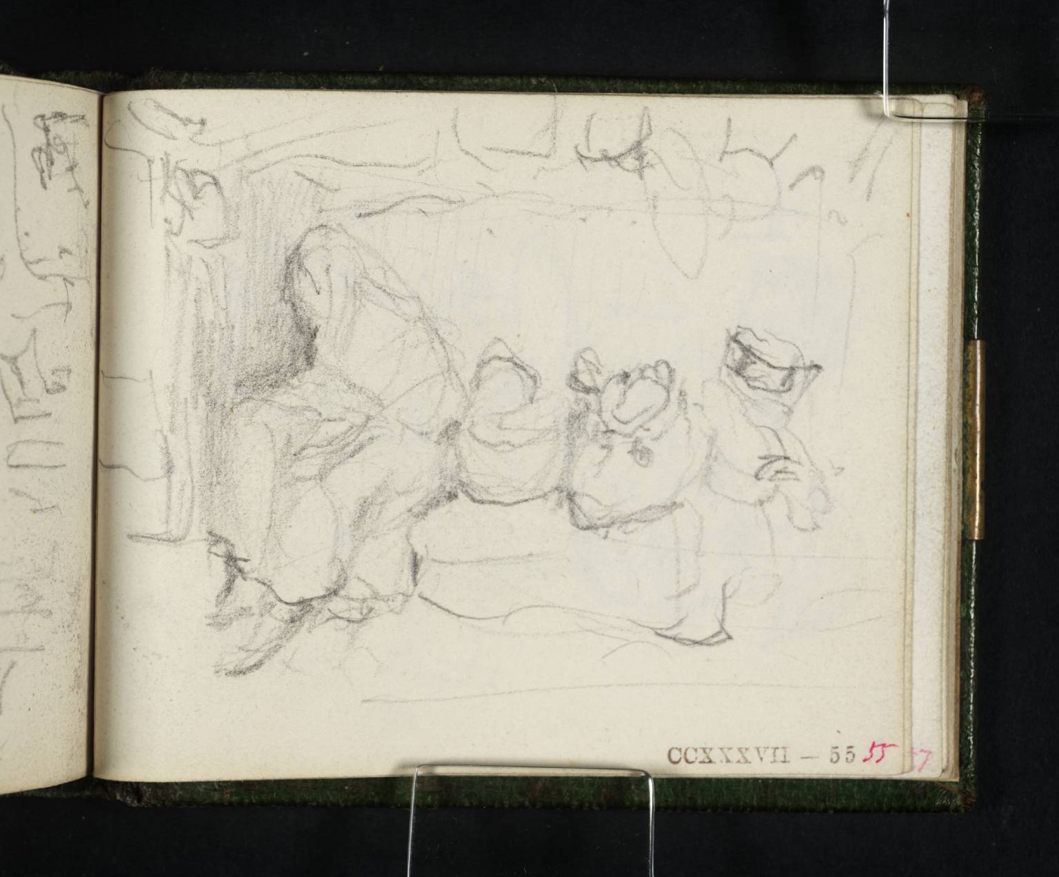 Woman Wrapped in Shawl Seated with Packages beside Her