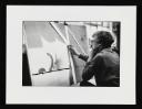 Prunella Clough, ‘Black and white photograph of Prunella Clough at work in her studio’ [1982]