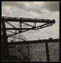 Prunella Clough, ‘Black and white photograph of the arm of a crane extended over water’ [1950s]