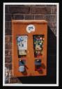 Prunella Clough, ‘Colour photograph of a gumball machine mounted on a wall’ [c.1993]