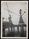 Prunella Clough, ‘Black and white photograph of cranes on a pier’ [1950s]