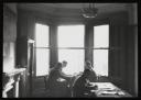 Major H. O. Daniel, ‘Photograph of internees working at desks at Hutchinson Internment Camp’ [c.1940–1]