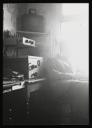 Major H. O. Daniel, ‘Photograph of internee beside recording equipment at Hutchinson Internment Camp’ [c.1940–1]
