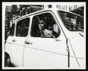 Ian Breakwell, Kevin Coyne, Felicity Sparrow, ‘Black and white photograph of a masked man sitting in the drivers seat of a white car’ [c.1978]