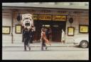 Anonymous, ‘Colour photograph of Dougie Thomson holding a large clown placard outside the Pavilion Theatre, Glasgow’ [c.1978]