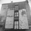 Nigel Henderson, ‘Photograph showing exterior of a building with advertisements’ [c.1949–c.1956]