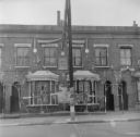 Nigel Henderson, ‘Photograph showing house fronts decorated to mark the Coronation’ [c.1949–c.1956]