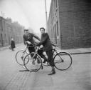 Nigel Henderson, ‘Photograph of two unidentified young men on bicycles’ [c.1949–c.1956]