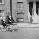 Nigel Henderson, ‘Photograph of an unidentified man and boy on a bicycle’ [1953]