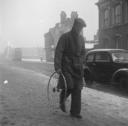 Nigel Henderson, ‘Photograph of an unidentified man carrying a bicycle wheel’ [1953]