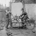 Nigel Henderson, ‘Photograph of an two unidentified boys, one boy is on a bicycle’ [1953]