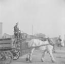 Nigel Henderson, ‘Photograph showing a horse pulling a cart’ [c.1949–c.1956]