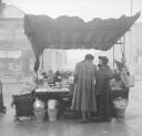 Nigel Henderson, ‘Photograph of two women at an outdoor market stall’ [c.1949–c.1956]