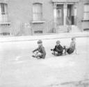 Nigel Henderson, ‘Photograph showing three unidentified boys playing in the street’ [c.1949–c.1956]