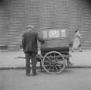 Nigel Henderson, ‘Photograph showing a street vendor with a cart’ [c.1949–c.1956]