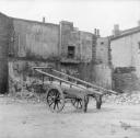 Nigel Henderson, ‘Photograph showing a cart, building in disrepair in background’ [c.1949–c.1956]