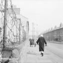 Nigel Henderson, ‘Photograph showing a barbed wire fence along an unidentified street’ [c.1949–c.1956]