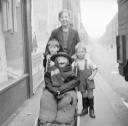 Nigel Henderson, ‘Photograph of three unidentified boys with a stuffed figure in a child’s pram’ [c.1949–c.1956]
