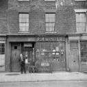 Nigel Henderson, ‘Photograph showing shop front of R.H. Winter’ [c.1949–c.1956]
