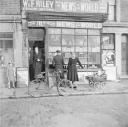 Nigel Henderson, ‘Photograph showing shop front of W. & F. Riley, newsagents and confectioners’ [c.1949–c.1956]