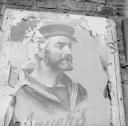 Nigel Henderson, ‘Photograph showing a poster attached to a wall featuring an image of a sailor’ [c.1949–c.1956]