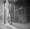 Nigel Henderson, ‘Photograph of an unidentified man outside a stage door’ [c.1949–c.1956]