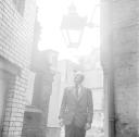 Nigel Henderson, ‘Photograph of Harry Craig in between damaged buildings ’ [c.1949–c.1956]
