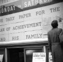 Nigel Henderson, ‘Photograph showing an unidentified man reading an advertisement’ [c.1949–c.1956]