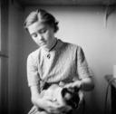 Nigel Henderson, ‘Photograph of an unidentified girl holding a siamese cat’ [c.1949–c.1956]