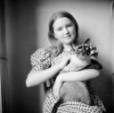 Nigel Henderson, ‘Photograph of an unidentified girl holding a siamese cat’ [c.1949–c.1956]