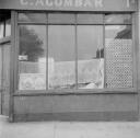 Nigel Henderson, ‘Photograph showing shop front of C. Acombar’ [c.1949–c.1956]