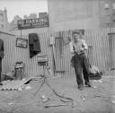 Nigel Henderson, ‘Photograph showing a street entertainer performing ’ [1952]