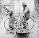 Nigel Henderson, ‘Photograph showing two unidentified children playing with bicycle wheels’ [c.1949–c.1956]