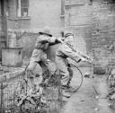 Nigel Henderson, ‘Photograph showing two unidentified children playing with bicycle wheels’ [c.1949–c.1956]