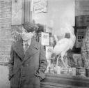 Nigel Henderson, ‘Photograph showing an unidentified boy outside a shop’ [c.1949–c.1956]