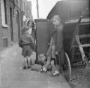 Nigel Henderson, ‘Photograph showing a group of children in the street beside a cart’ [c.1949–c.1956]