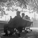 Nigel Henderson, ‘Photograph showing a group of men sitting on a bench’ [c.1949–c.1956]