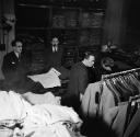 Nigel Henderson, ‘Photograph showing musicians inside a shop selling men’s clothes’ [c.1949–c.1956]