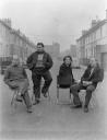 Anonymous, ‘Photograph showing Nigel Henderson, Eduardo Paolozzi, Alice and Peter Smithson, seated in an unidentified street’ [c.1949–c.1956]