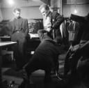 Nigel Henderson, ‘Photograph of Pete King being fitted in a shop selling men’s clothes’ [c.1949–c.1956]