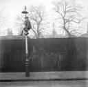 Nigel Henderson, ‘Photograph showing a boy climbing a lamp post on an unidentified street’ [c.1949–c.1956]