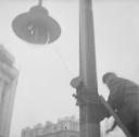 Nigel Henderson, ‘Photograph showing an unidentified man on a ladder next to a gas street lamp’ [c.1949–c.1956]