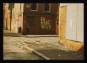 Conrad Atkinson, ‘Colour photograph of a street in Northern Ireland and a wall painted with the words, ‘S.S. RUC Out’’ [c.1974–5]