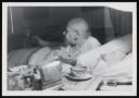 Marie-Louise Von Motesiczky, ‘Photograph of Henriette von Motesiczky sitting up in bed with a tray of food beside her, feeding a dog’ [c.1960s]