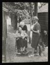 Unknown Photographer, ‘Photograph of Henriette von Motesiczky in a wheelchair with Marie-Louise von Motesiczky bent over her, and another woman standing beside them’ [c.1970s]