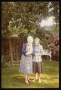 Unknown Photographer, ‘Photograph of Marie-Louise von Motesickzy standing in a garden holding a dog with an unidentified woman’ June 1978