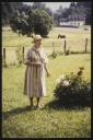 Unknown Photographer, ‘Photograph of Marie-Louise von Motesiczky standing in a field with a tractor in the background ’ [c.1980s–1996]