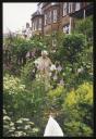 Unknown Photographer, ‘Photograph of Marie-Louise von Motesiczky standing in a garden with houses in the background ’ [c.1990s]